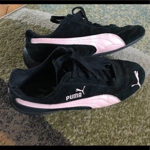 Black and pink Puma suede sneakers